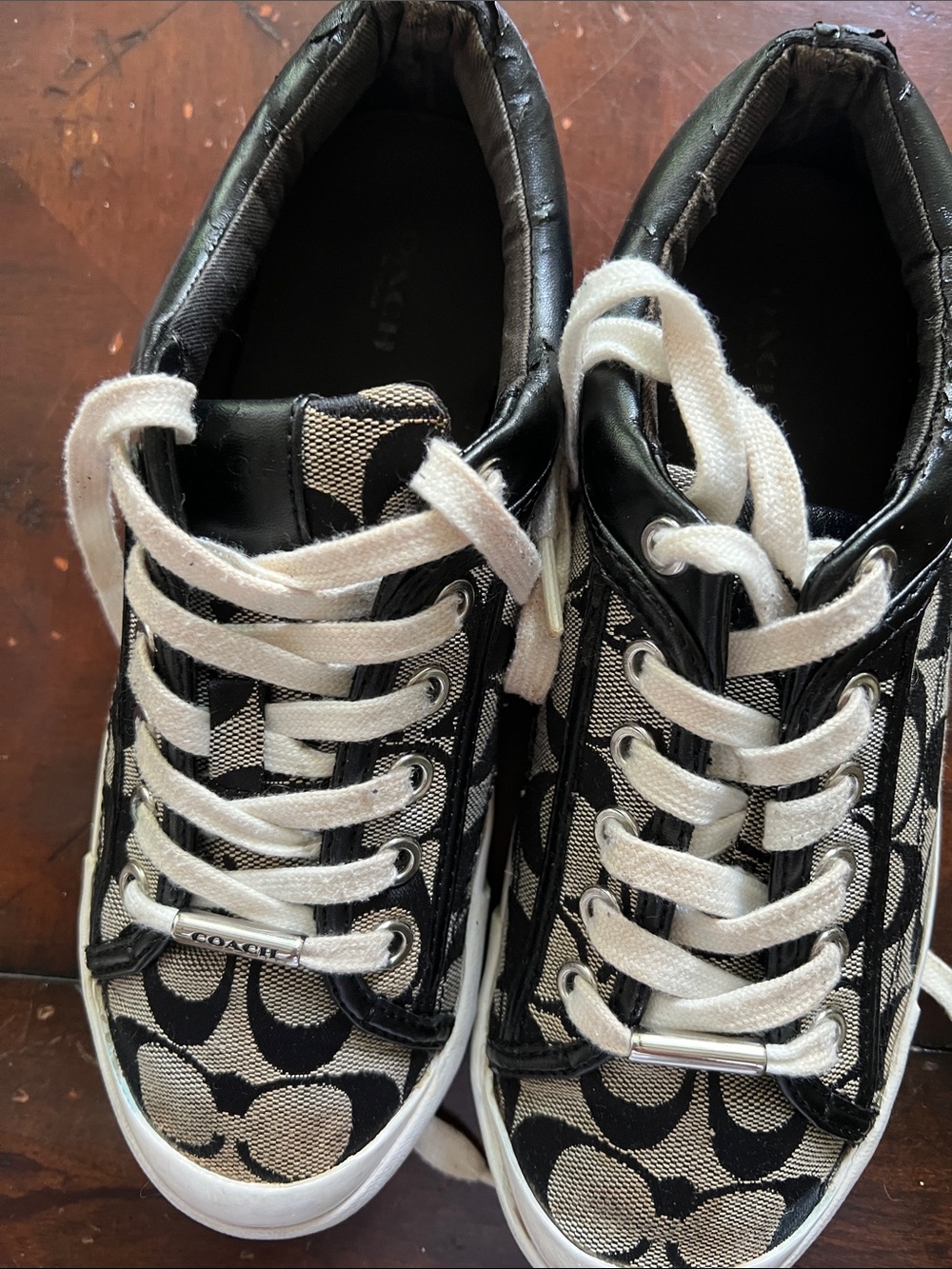 Coach women’s size 7B signature Canvas Sneakers in Black and Cream
